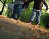 Children collecting autumn leaves