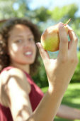 Girl holding pear