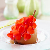 Poached pear with rose petals