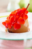 Poached pear with rose petals