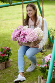 Lady with hydrangea flowers