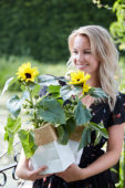 Lady holding sunflowers