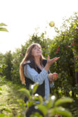 Young lady in apple orchard