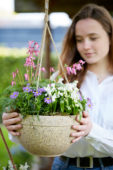 Young lady with hanging basket