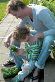 Father and son planting lobelias