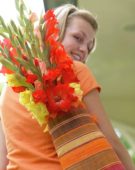 Woman with Gladiolus in bag
