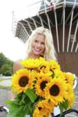 Woman holding sunflowers