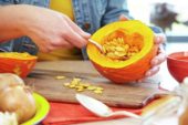 Hollowing out pumpkin for making soup