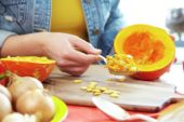 Hollowing out pumpkin for making soup