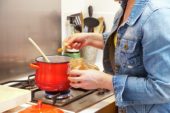 Adding curry powder to cooking pan