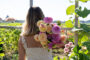 Lady holding bunch of dahlias