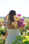 Lady holding bunch of dahlias