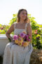 Lady holding bunch of dahlias