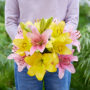 Lady holding bunch of lilies