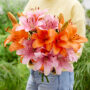 Lady holding bunch of lilies