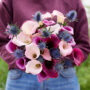 Lady holding mixed calla bouquet