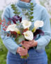 Lady holding mixed calla bouquet