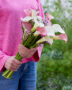 Lady holding mixed calla bouquet