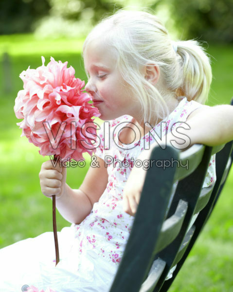 Girl holding dahlia