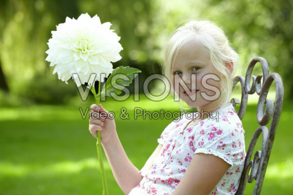 Girl holding dahlia