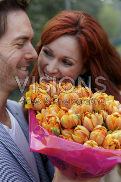 Couple holding flowers