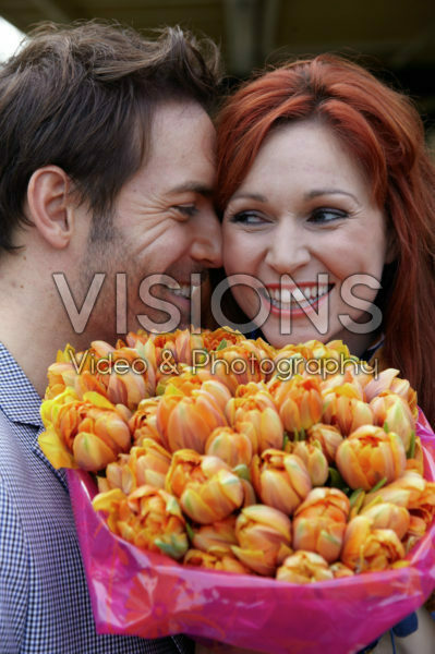 Couple holding flowers