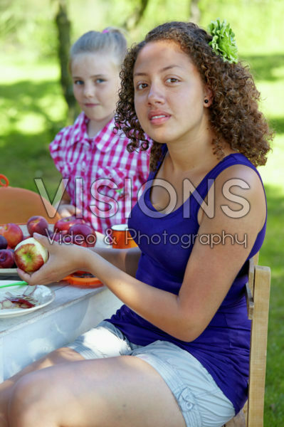 Girl peeling apple
