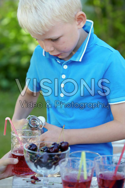 Boy pouring drink