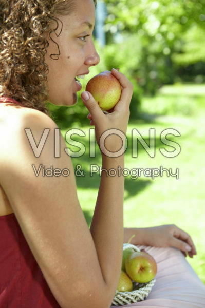 Girl eating pear