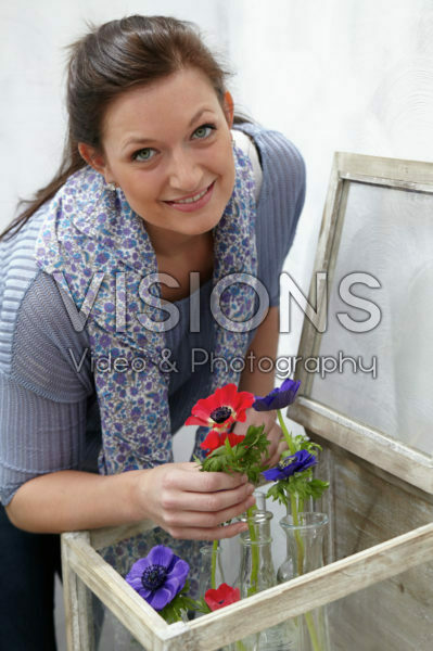 Woman arranging anemones