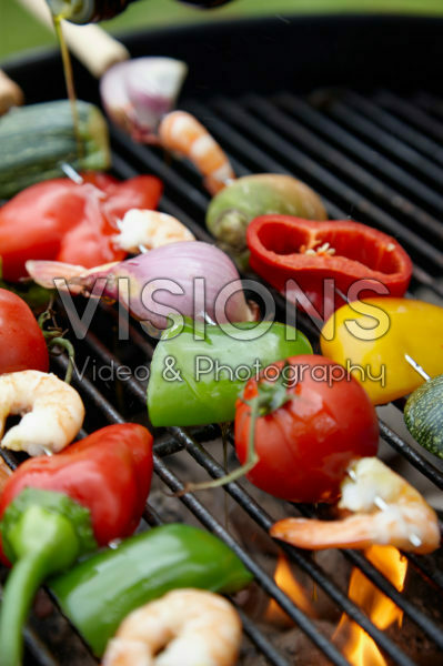 Vegetable and prawn skewers on the barbecue