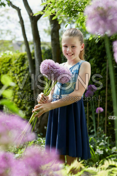 Girl holding Allium giganteum