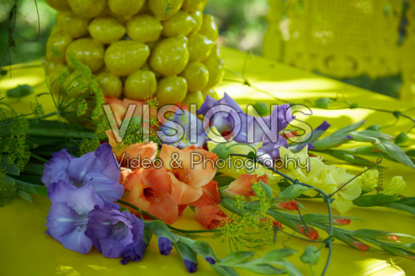 Gladioli on yellow table Gladioli on yellow table