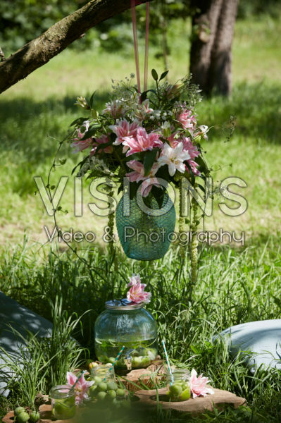 Hanging vase with lilies