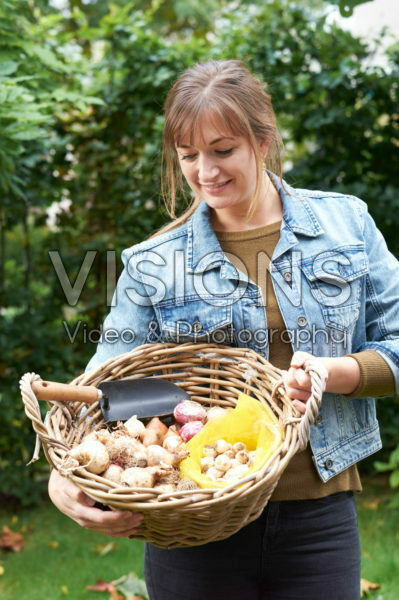 Young lady with flower bulbs Young lady with flower bulbs
