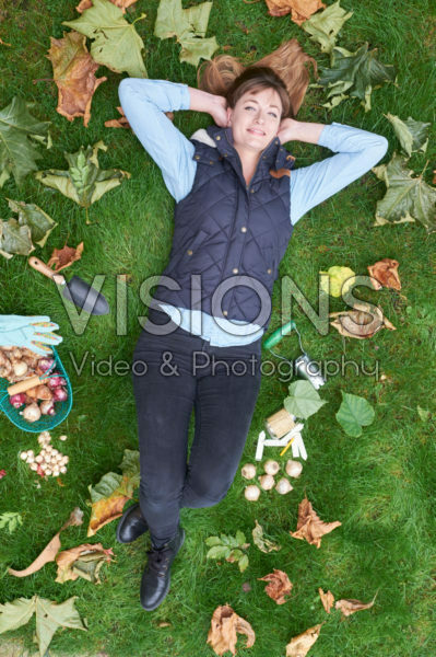 young lady lying in the grass