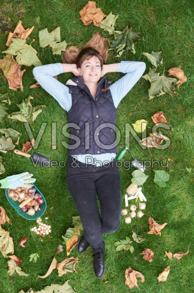 young lady lying in the grass