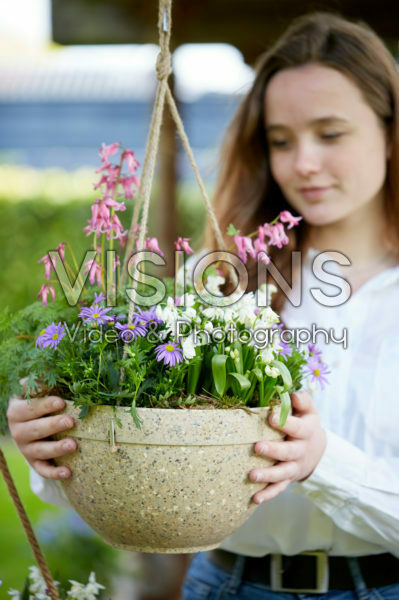 Young lady with hanging basket