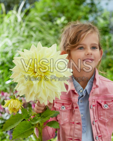 Girl with Dahlia Alva's Supreme flower