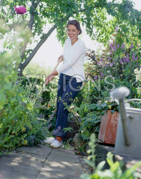 Woman working in summer garden