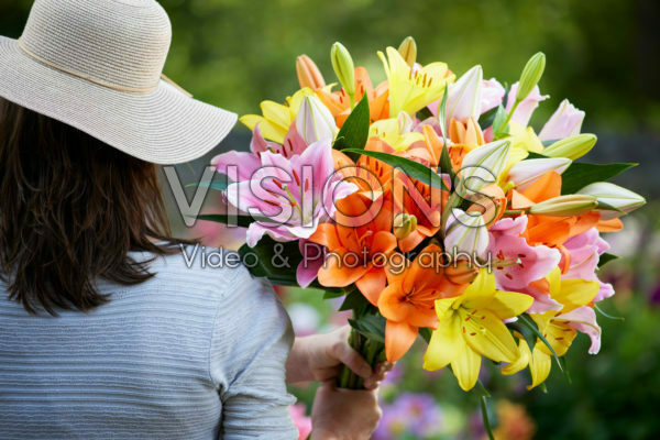 Lady holding bunch of lilies Lady holding bunch of lilies