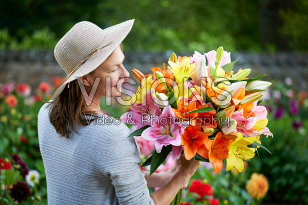 Lady holding bunch of lilies Lady holding bunch of lilies