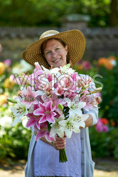 Lady holding bunch of lilies