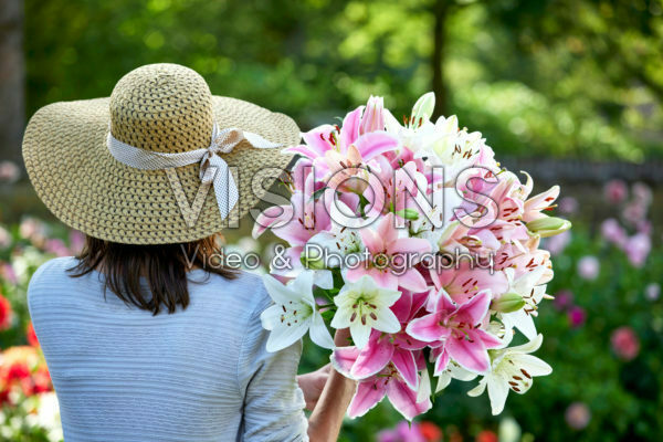 Lady holding bunch of lilies Lady holding bunch of lilies