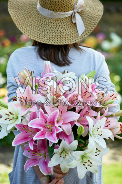 Lady holding bunch of lilies Lady holding bunch of lilies