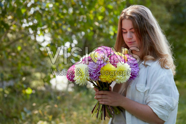 Lady holding bunch of dahlias Lady holding bunch of dahlias