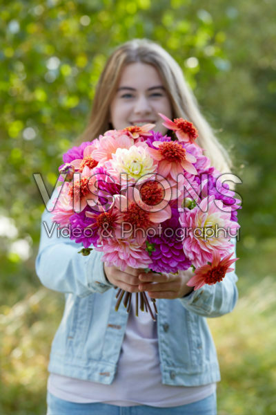 Lady holding bunch of dahlias Lady holding bunch of dahlias