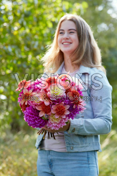 Lady holding bunch of dahlias Lady holding bunch of dahlias