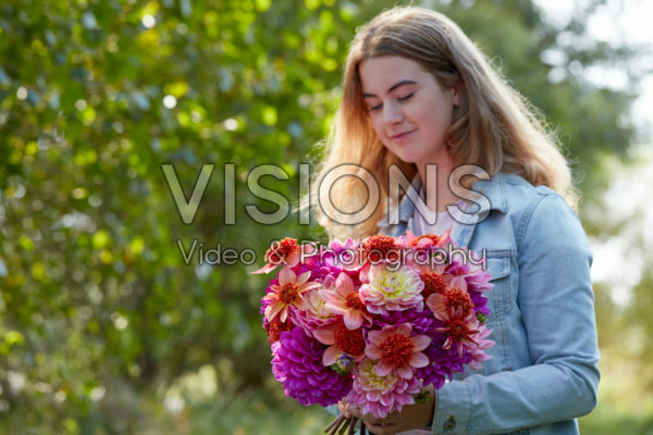 Lady holding bunch of dahlias Lady holding bunch of dahlias