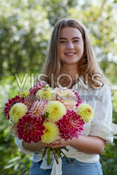 Lady holding bunch of dahlias